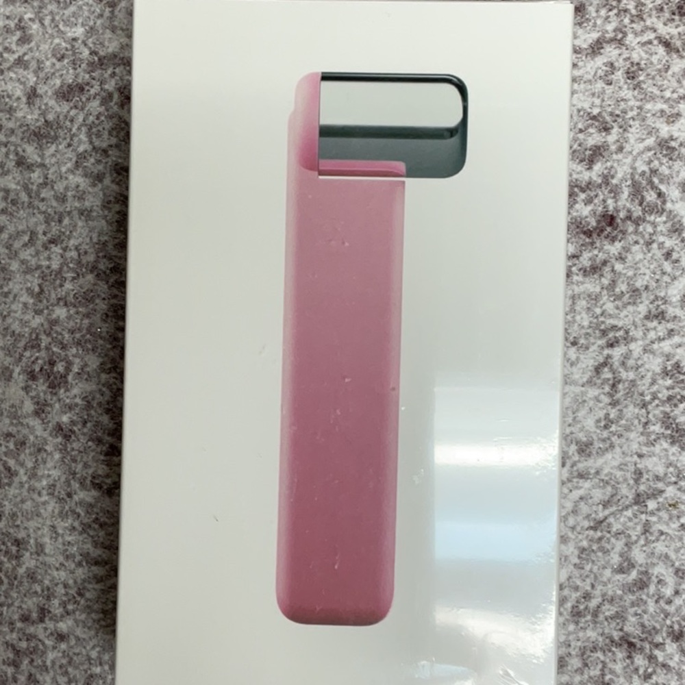 Pink Skincare Tool with Sleek Design and Metallic Accents